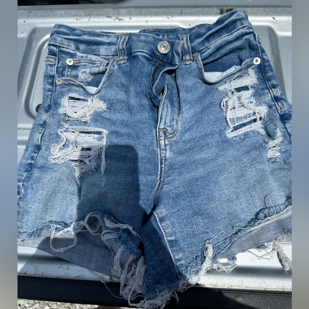 Ripped blue jeans shorts